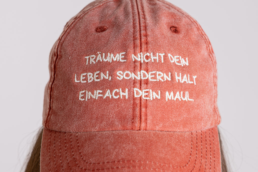 Base Cap "Träume nicht dein Leben" vintage orange