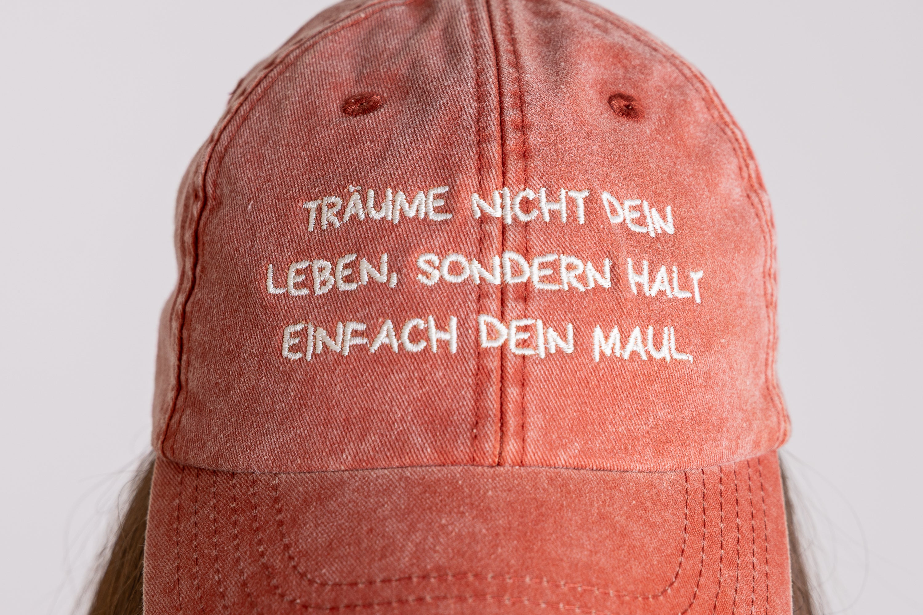 Base Cap "Träume nicht dein Leben" vintage orange